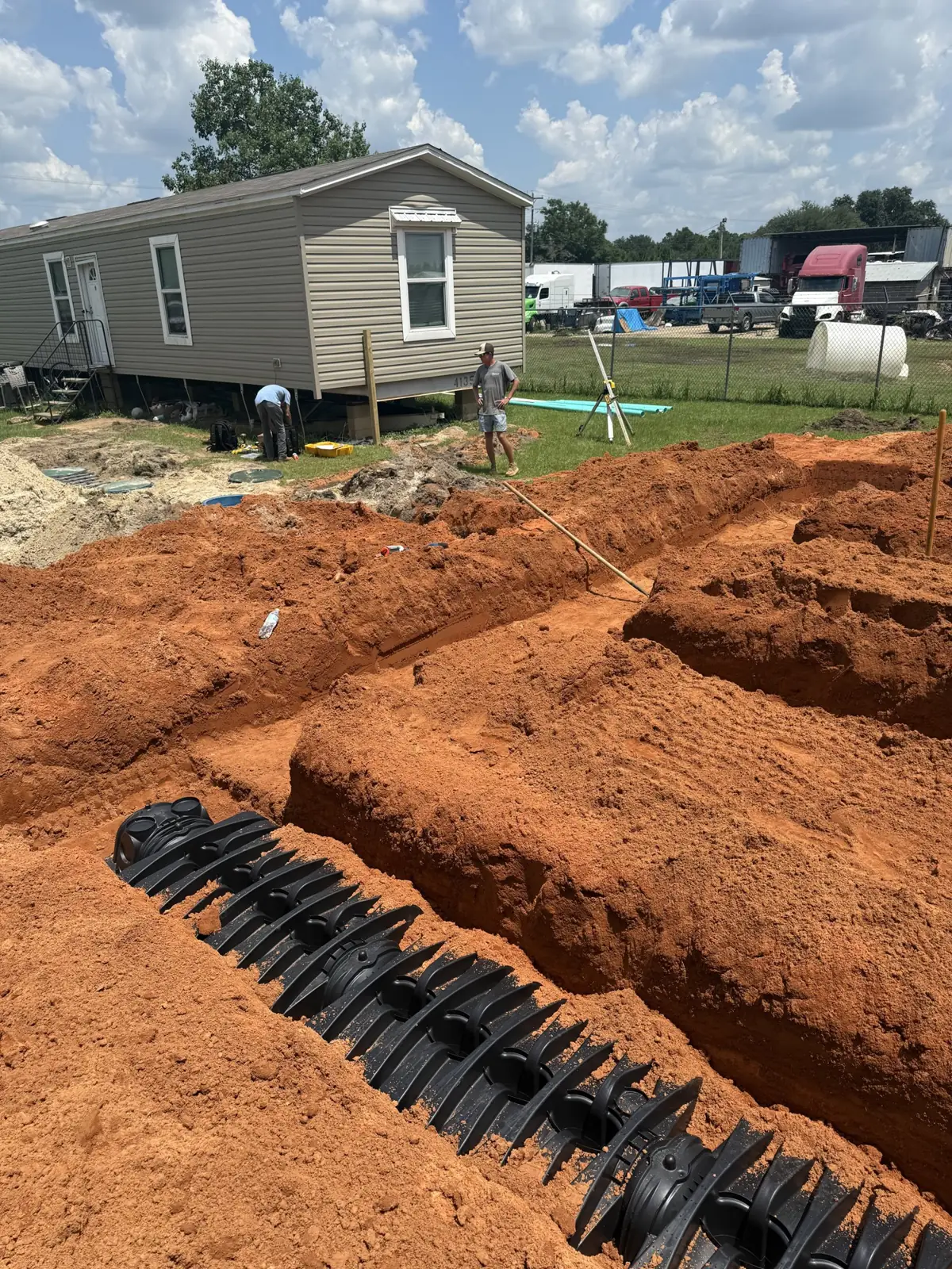 Chambers laid in a red-clay trench