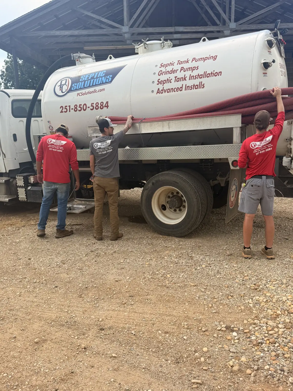 P&C crew members gathered around the pump truck