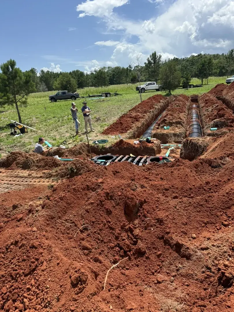 Aerial view of drain field trench pattern in red clay soil