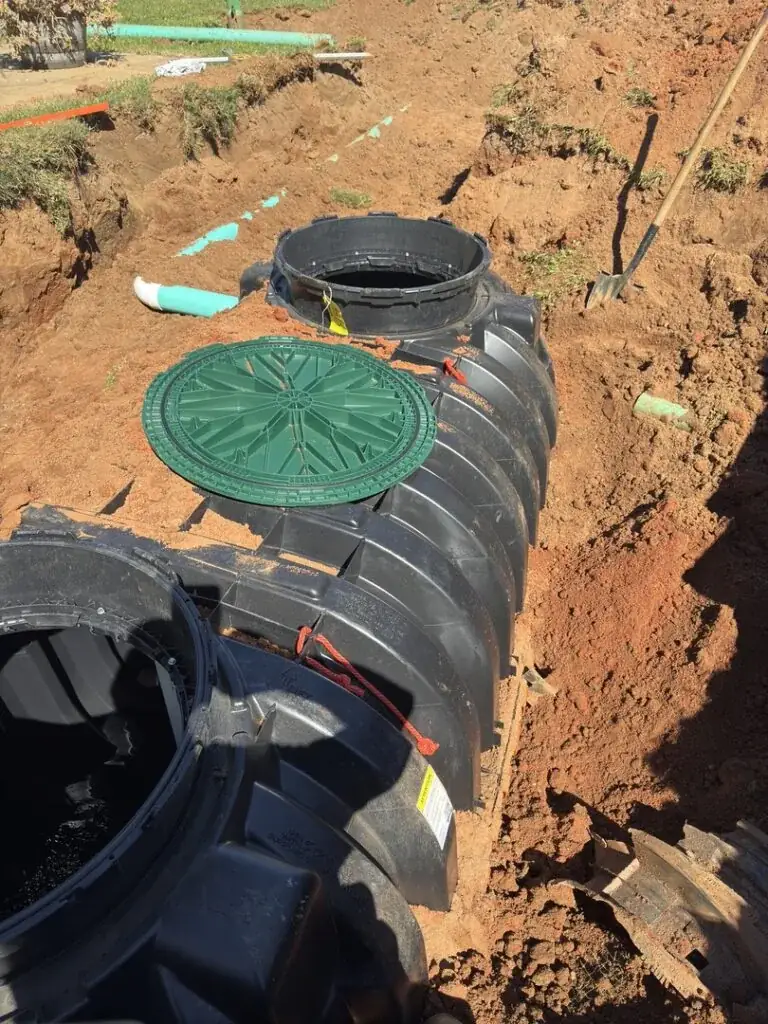 Septic tank installed with dual access risers